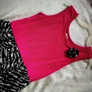 Features vibrant sleeveless crew neck sundress